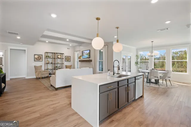 a spacious bedroom with a bed and a large window