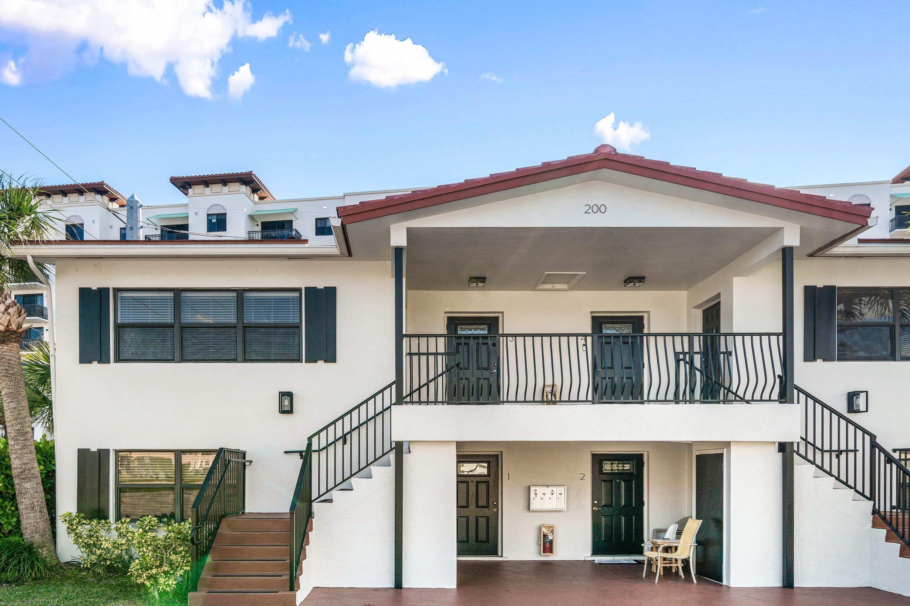 200 Southwest 7th Street, Unit 3 Boca Raton, FL 33432 - Photo 2 of 35 a front view of a house with a porch