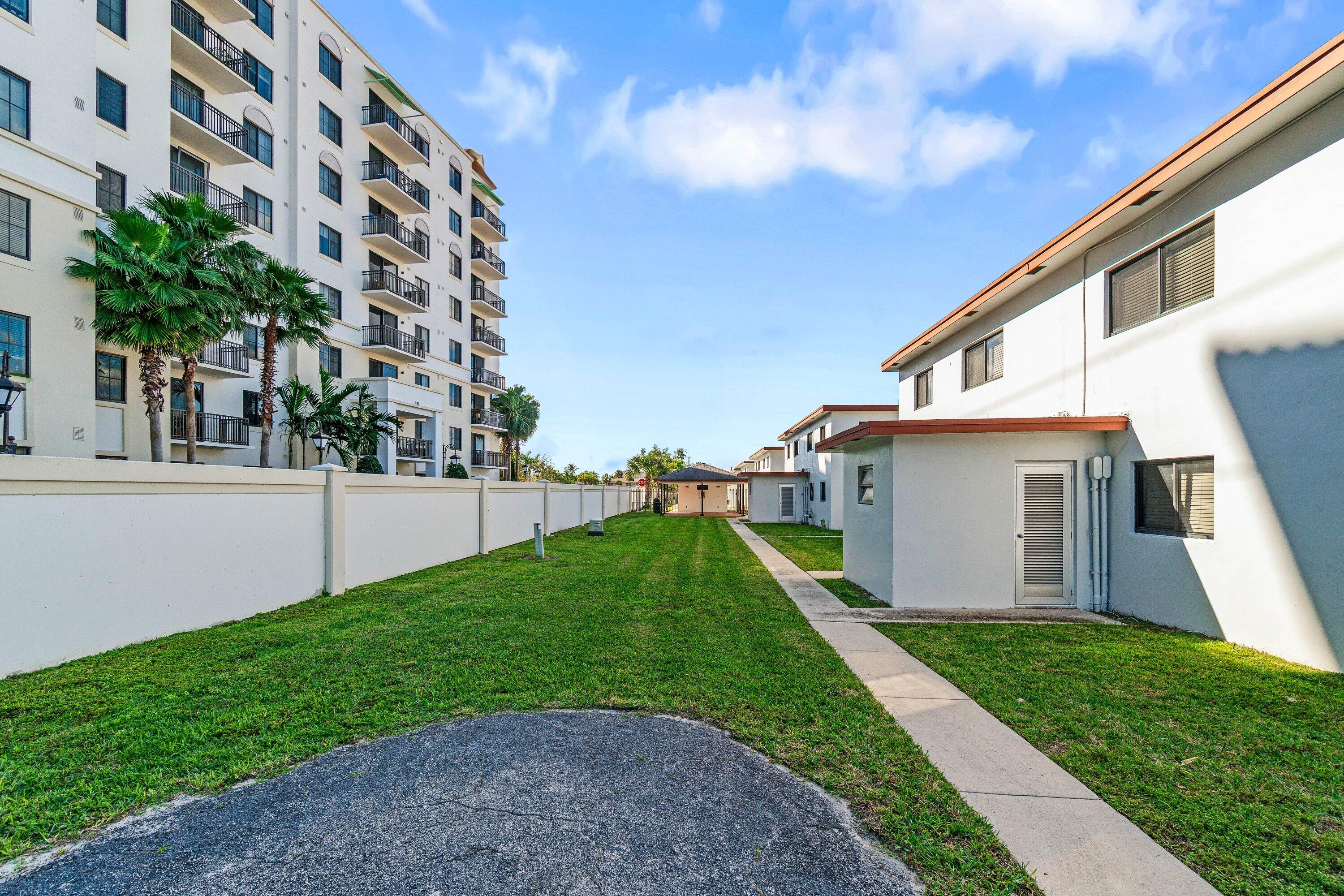 200 Southwest 7th Street, Unit 3 Boca Raton, FL 33432 - Photo 26 of 35 a view of a house with a yard and plants