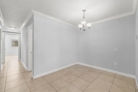 a view of a chandelier in an empty room