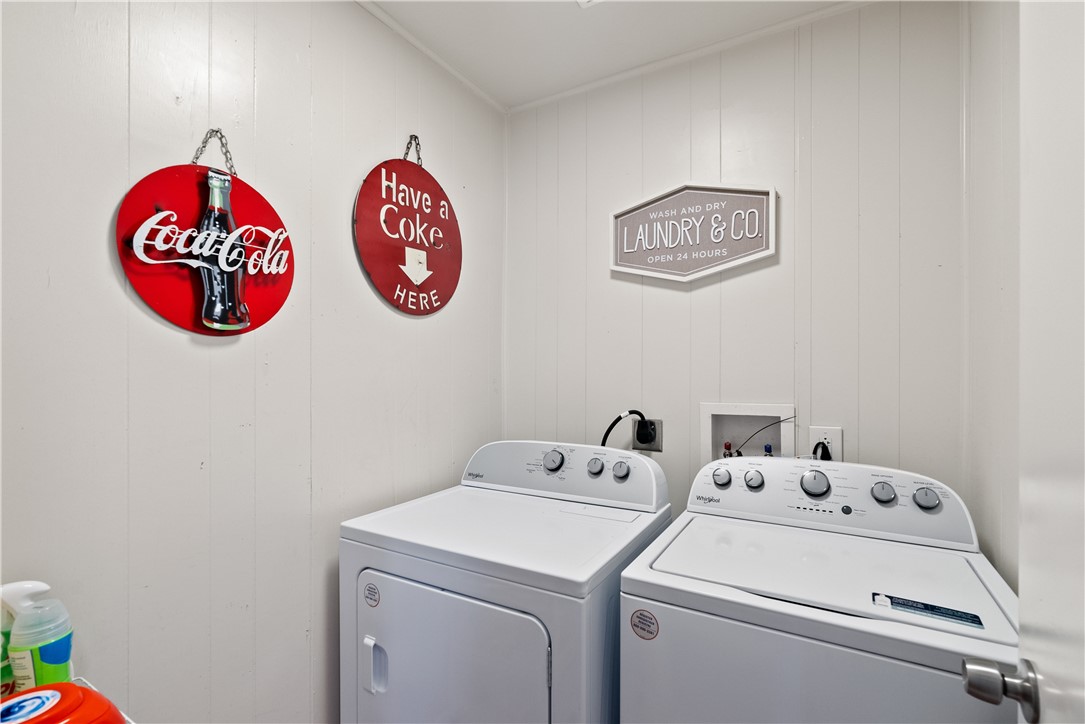1204 Fannin Street George West, TX 78022 - Photo 13 of 24 a view of storage and utility room with washer and dryer