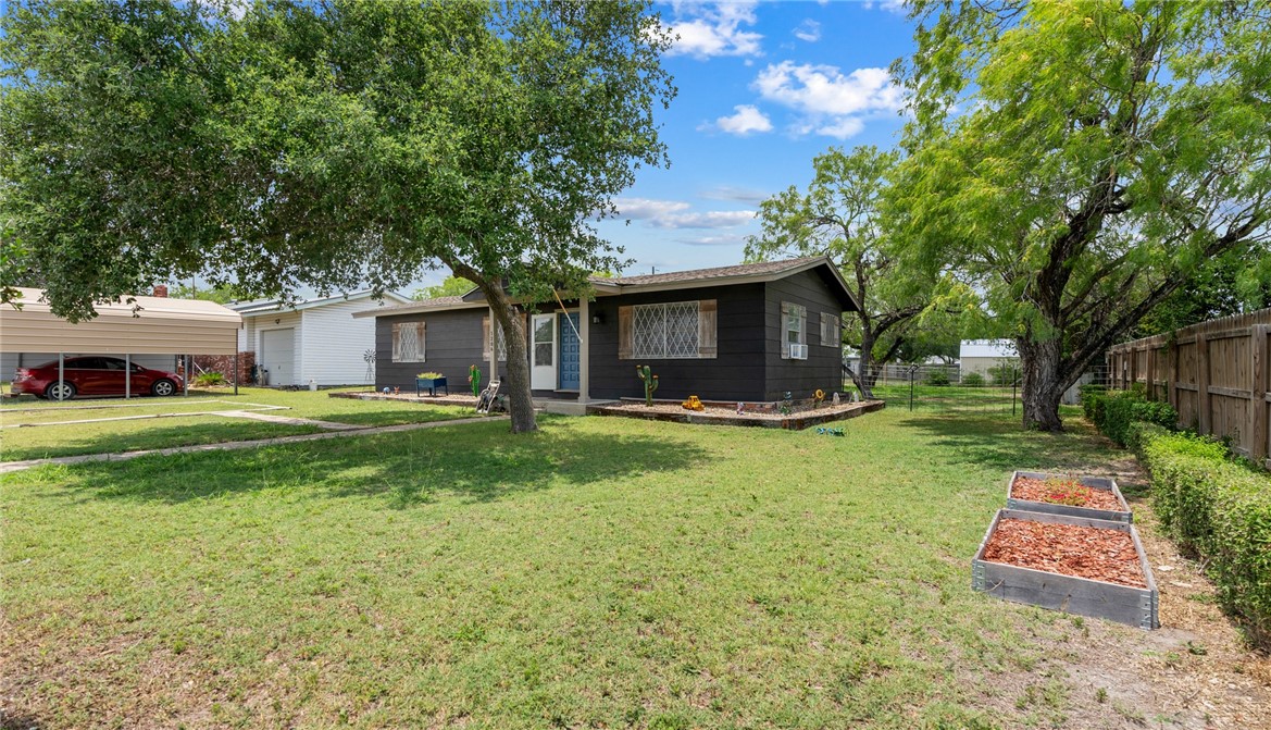 1204 Fannin Street George West, TX 78022 - Photo 20 of 24 a view of a house with backyard and sitting area