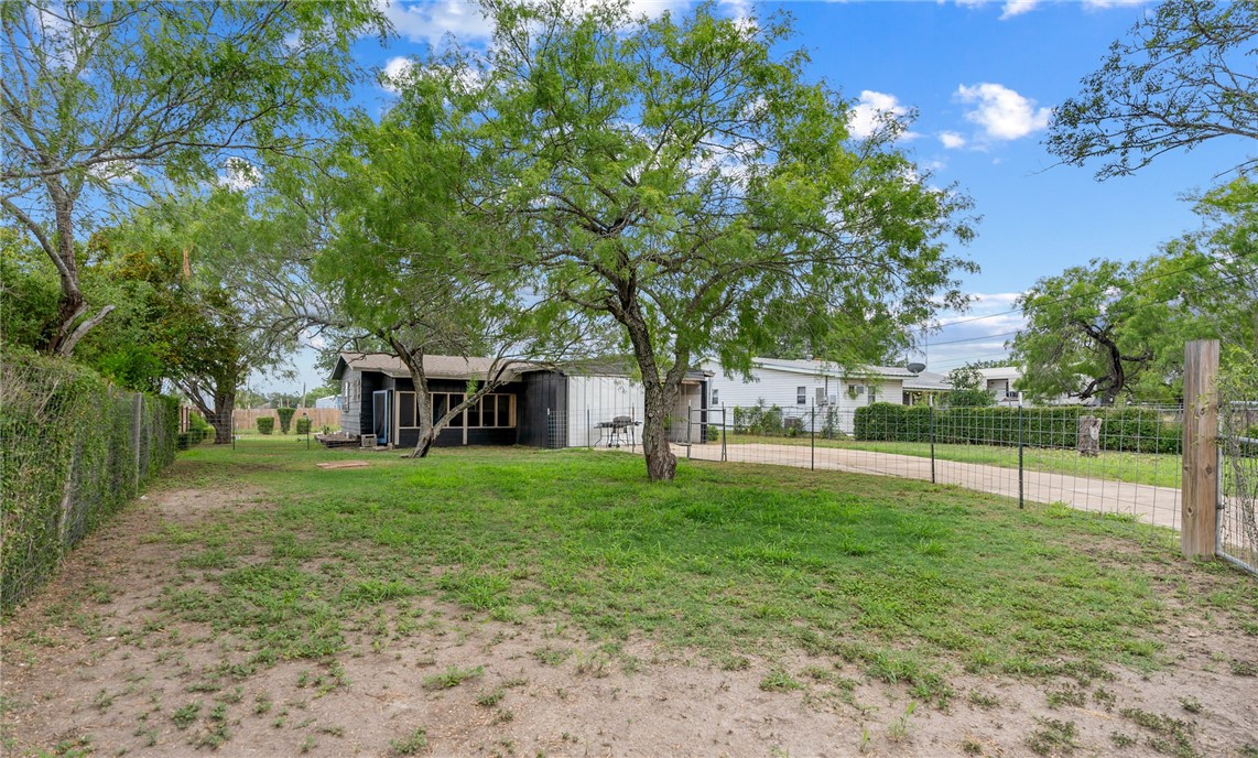 1204 Fannin Street George West, TX 78022 - Photo 21 of 24 a view of a yard with a house