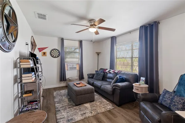 a living room with furniture and a window