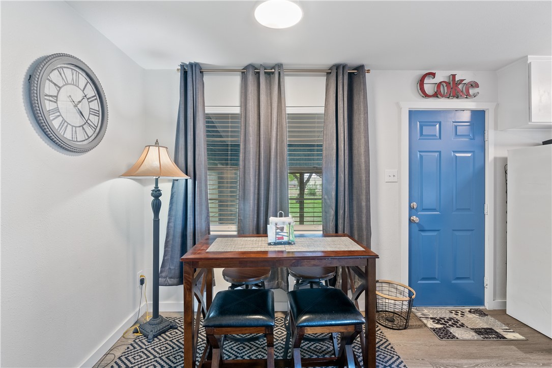 1204 Fannin Street George West, TX 78022 - Photo 6 of 24 a view of a dining room with furniture and window