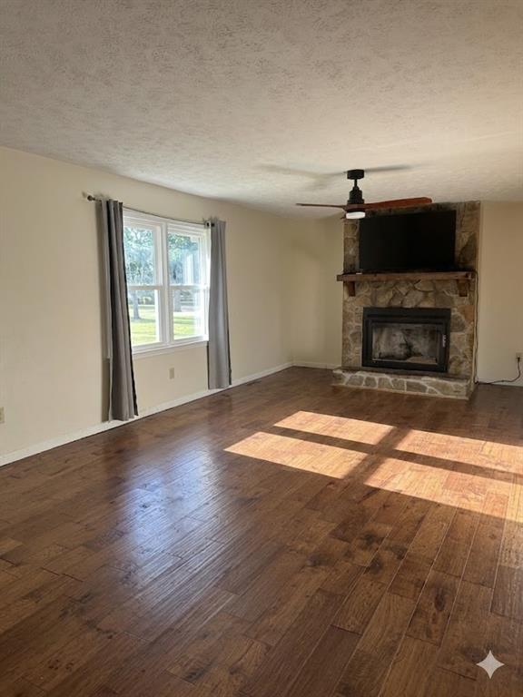 27 Carriage Trace Southeast Cartersville, GA 30121 - Photo 8 of 26 a view of empty room with wooden floor and fireplace