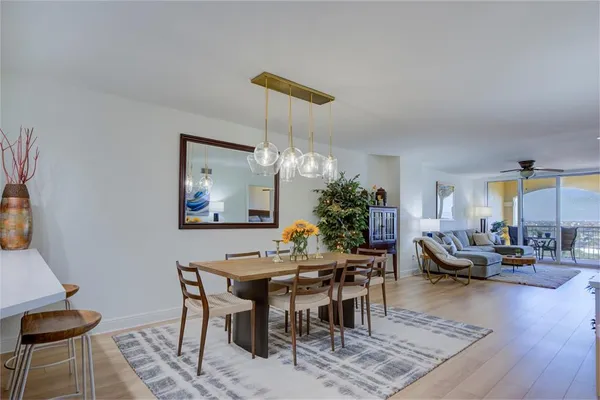 a view of a dining room with furniture window and wooden floor