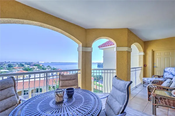 a view of a dining room with furniture wooden floor and chandelier