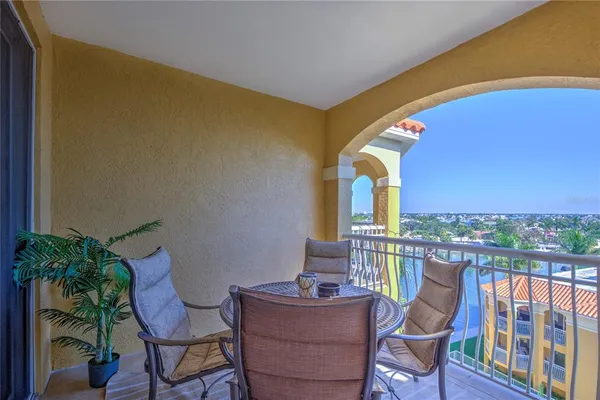 a view of balcony with furniture