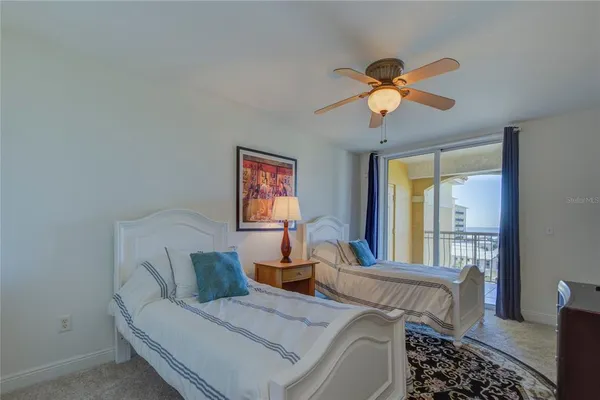 a living room with furniture a window and a chandelier