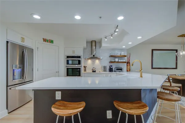 a kitchen with a table and chairs in it