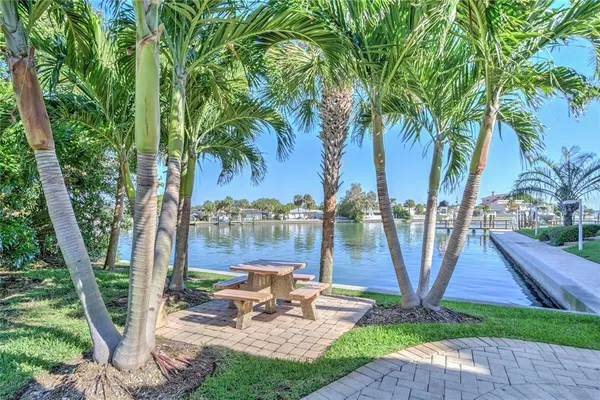 a view of backyard with plants and outdoor seating