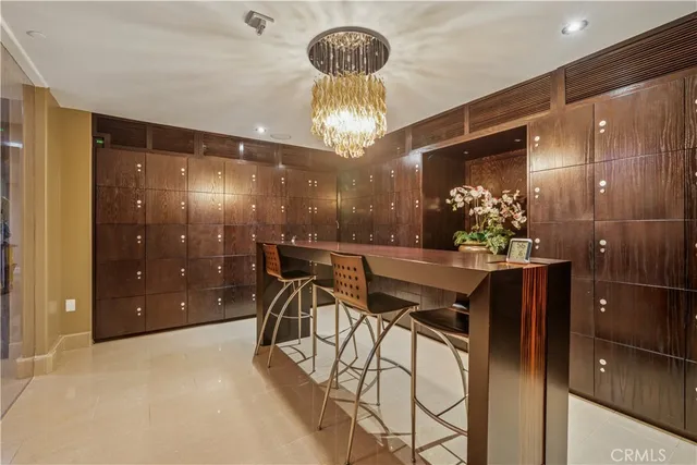 a dining room with furniture and chandelier