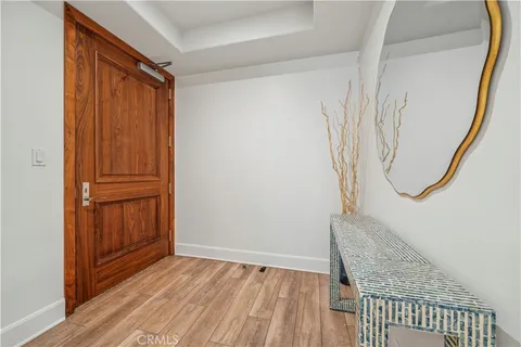 a view of front door with wooden floor