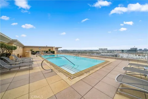 a view of a swimming pool with a lounge chair