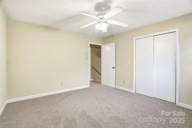 a living room with stainless steel appliances kitchen island granite countertop furniture and a fireplace