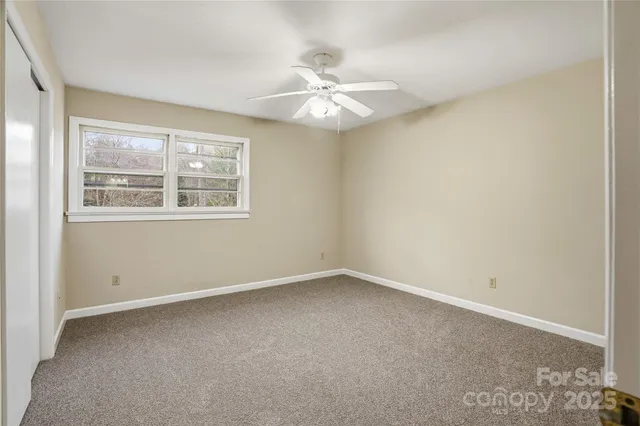 a bedroom with a bed and a chair