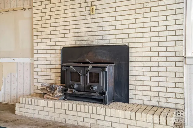 a view of empty room with white walls
