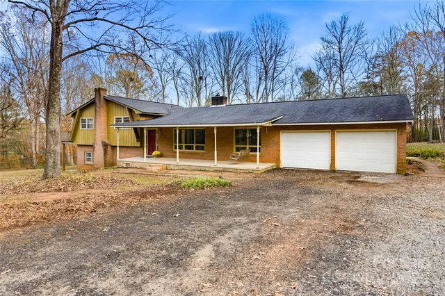 a view of a lush green hillside and a houses
