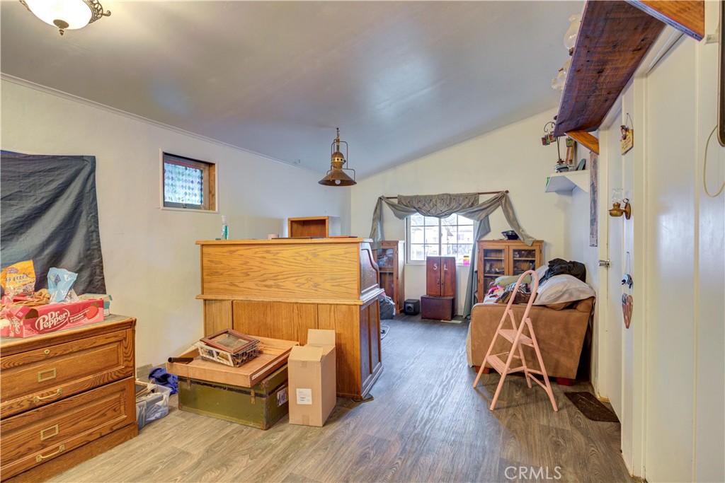 700 River Road, Unit 12 San Miguel, CA 93451 - Photo 7 of 13 a view of room with wooden floor and gym equipment