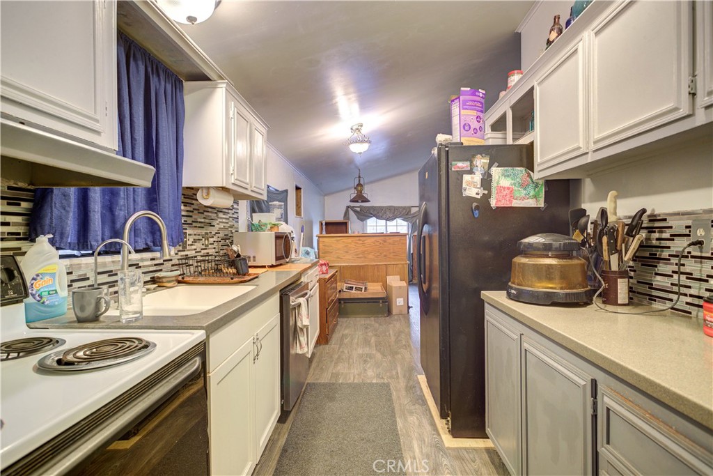700 River Road, Unit 12 San Miguel, CA 93451 - Photo 9 of 13 a kitchen with stove cabinets and a sink