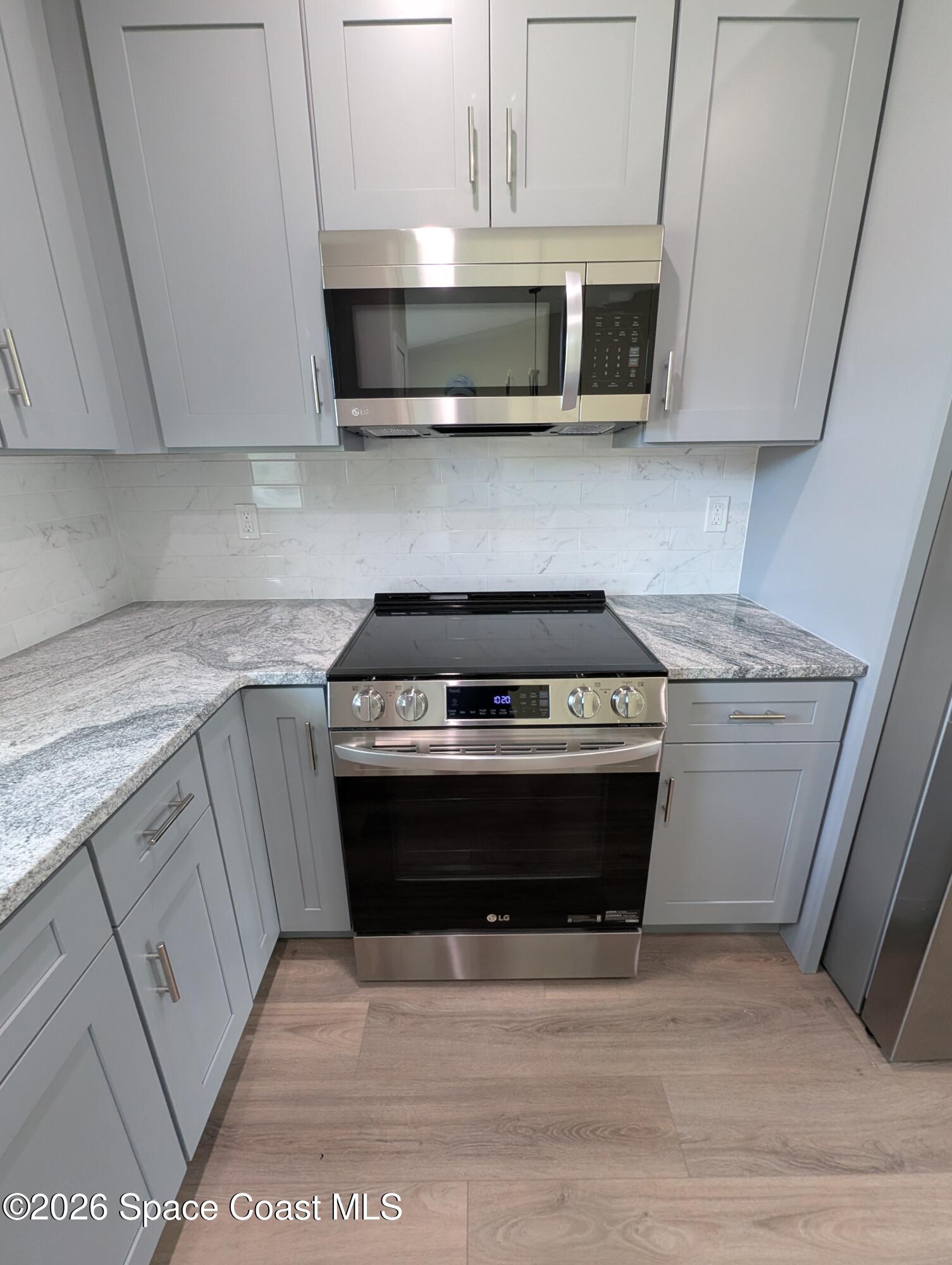1356 Torgerson Road Southeast Palm Bay, FL 32909 - Photo 28 of 46 Stove and Microwave 1