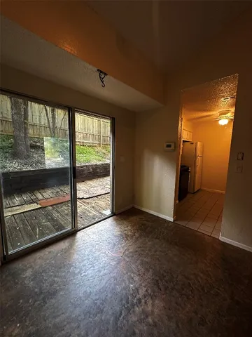 a view of empty room with floor to ceiling window