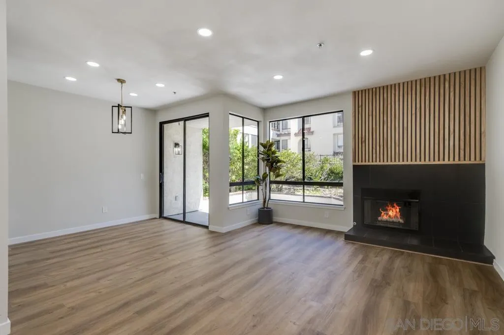 5845 Friars Road, Unit 1116 San Diego, CA 92110 - Photo 1 of 30 a view of an empty room with a fireplace and a window