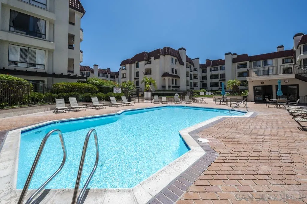 5845 Friars Road, Unit 1116 San Diego, CA 92110 - Photo 22 of 30 a swimming pool with outdoor seating and yard