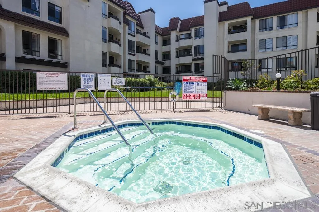 5845 Friars Road, Unit 1116 San Diego, CA 92110 - Photo 23 of 30 a view of building with a swimming pool