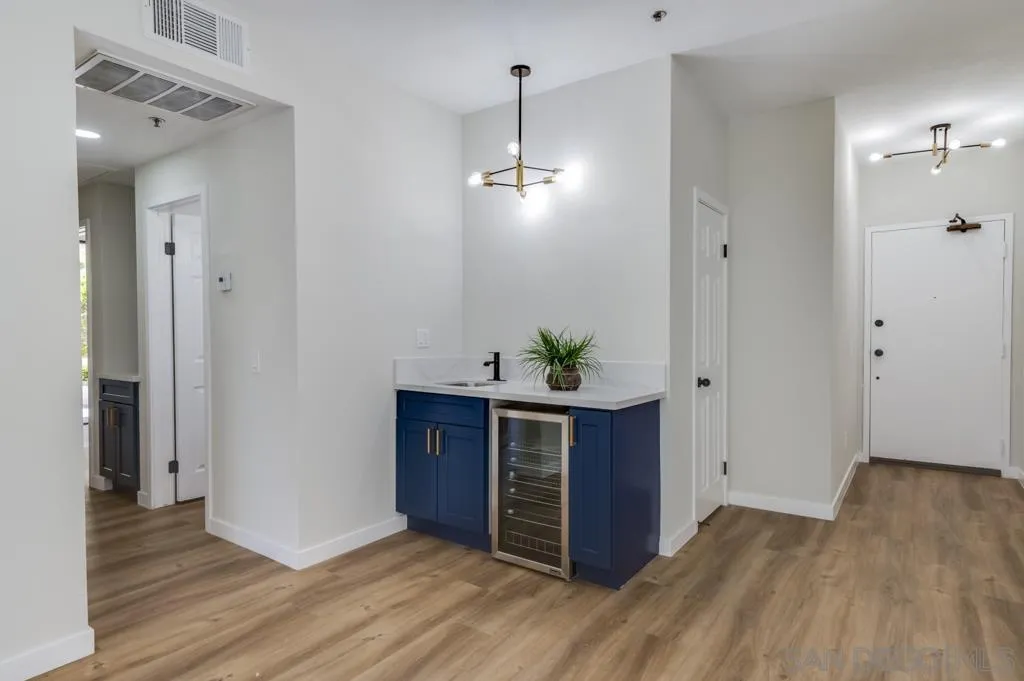 5845 Friars Road, Unit 1116 San Diego, CA 92110 - Photo 10 of 30 a view of a room with wooden floor and window