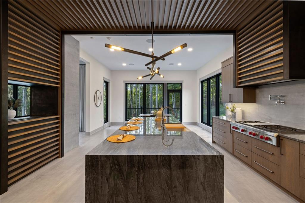 809 Mt Pleasant Road Mars, PA 16046 - Photo 11 of 46 a kitchen with stainless steel appliances granite countertop a sink stove and cabinets