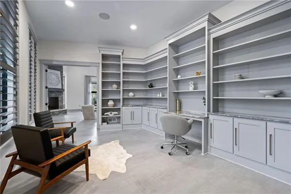 a room with a chair and white walls