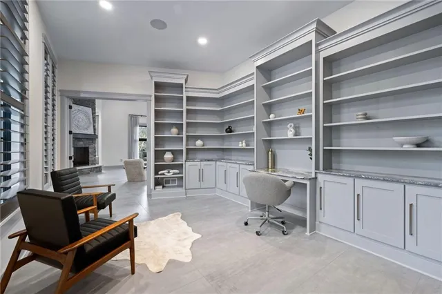 a room with a chair and white walls