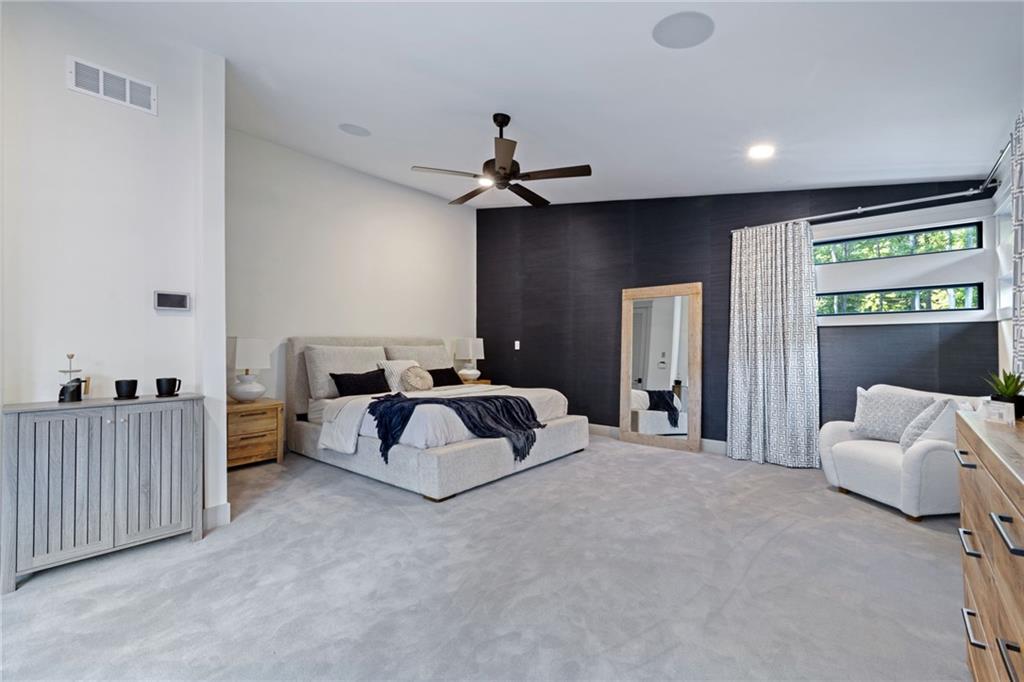 809 Mt Pleasant Road Mars, PA 16046 - Photo 18 of 46 a spacious bedroom with a bed and a couch