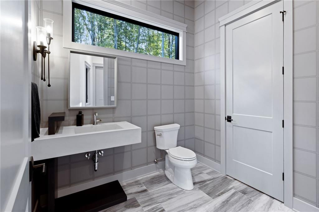 809 Mt Pleasant Road Mars, PA 16046 - Photo 21 of 46 a bathroom with a toilet a sink and a mirror