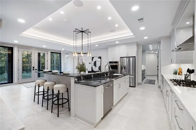 a kitchen with counter space cabinets and appliances
