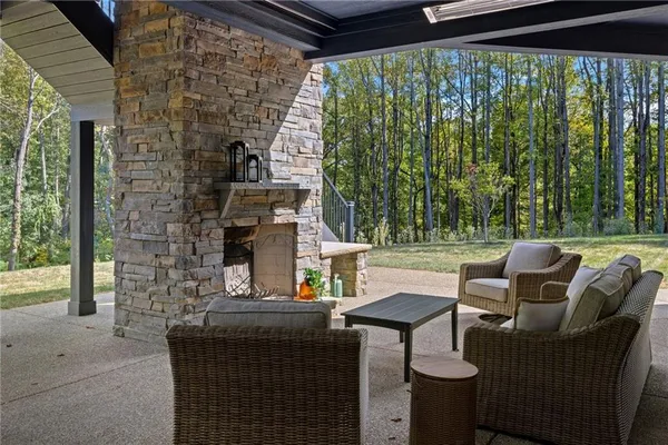 a backyard of a house with outdoor seating