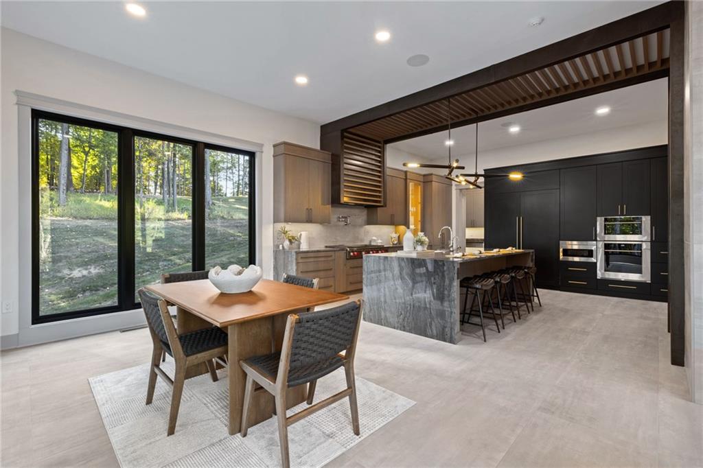 809 Mt Pleasant Road Mars, PA 16046 - Photo 10 of 46 a dining hall with stainless steel appliances a table and chairs