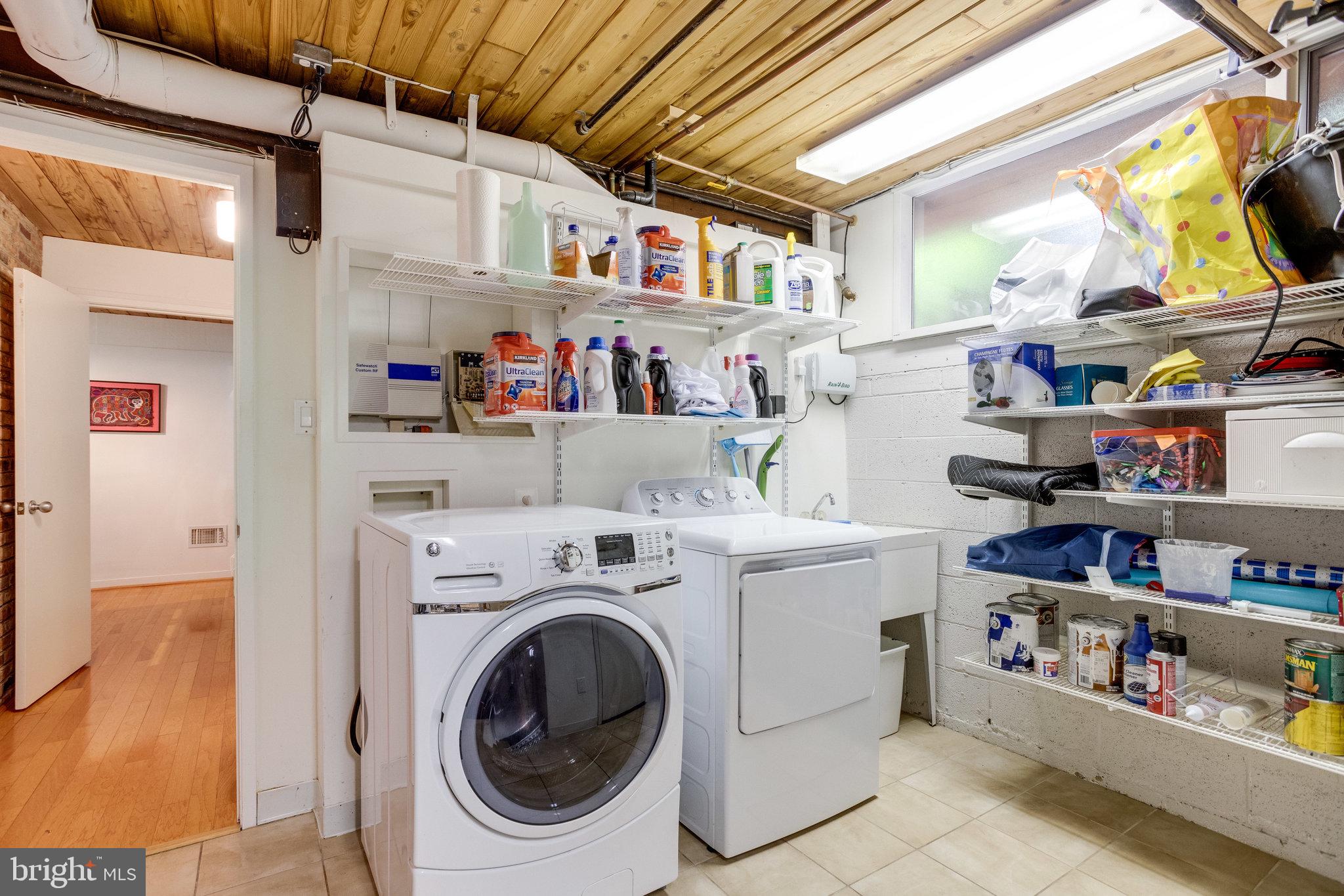 5910 Chesterbrook Road McLean, VA 22101 - Photo 43 of 53 Washer Dryer with Shelving and Natural Light