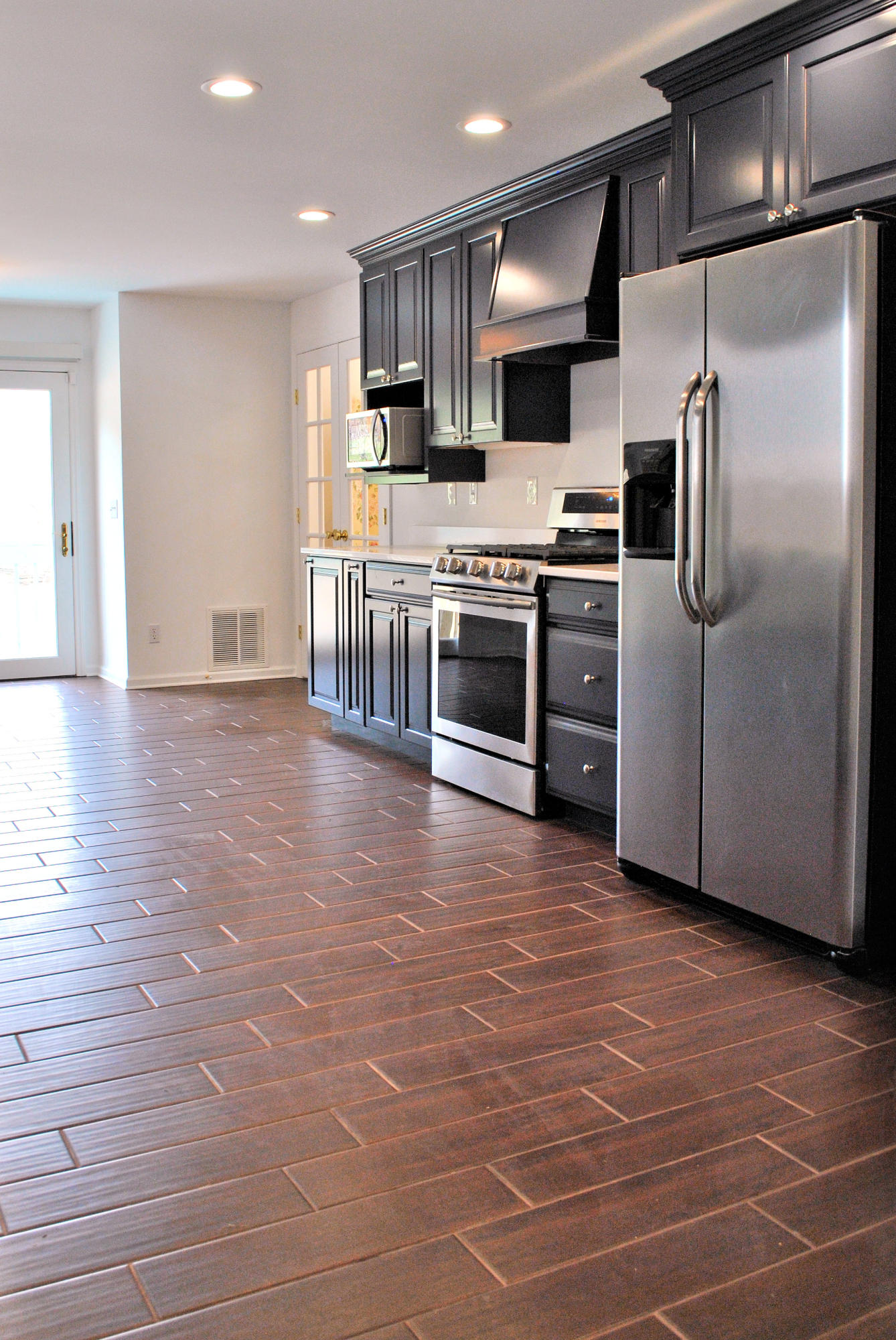 6500 Little Camp Road Riner, VA 24149 - Photo 23 of 121 a kitchen with stainless steel appliances a refrigerator and a stove top oven