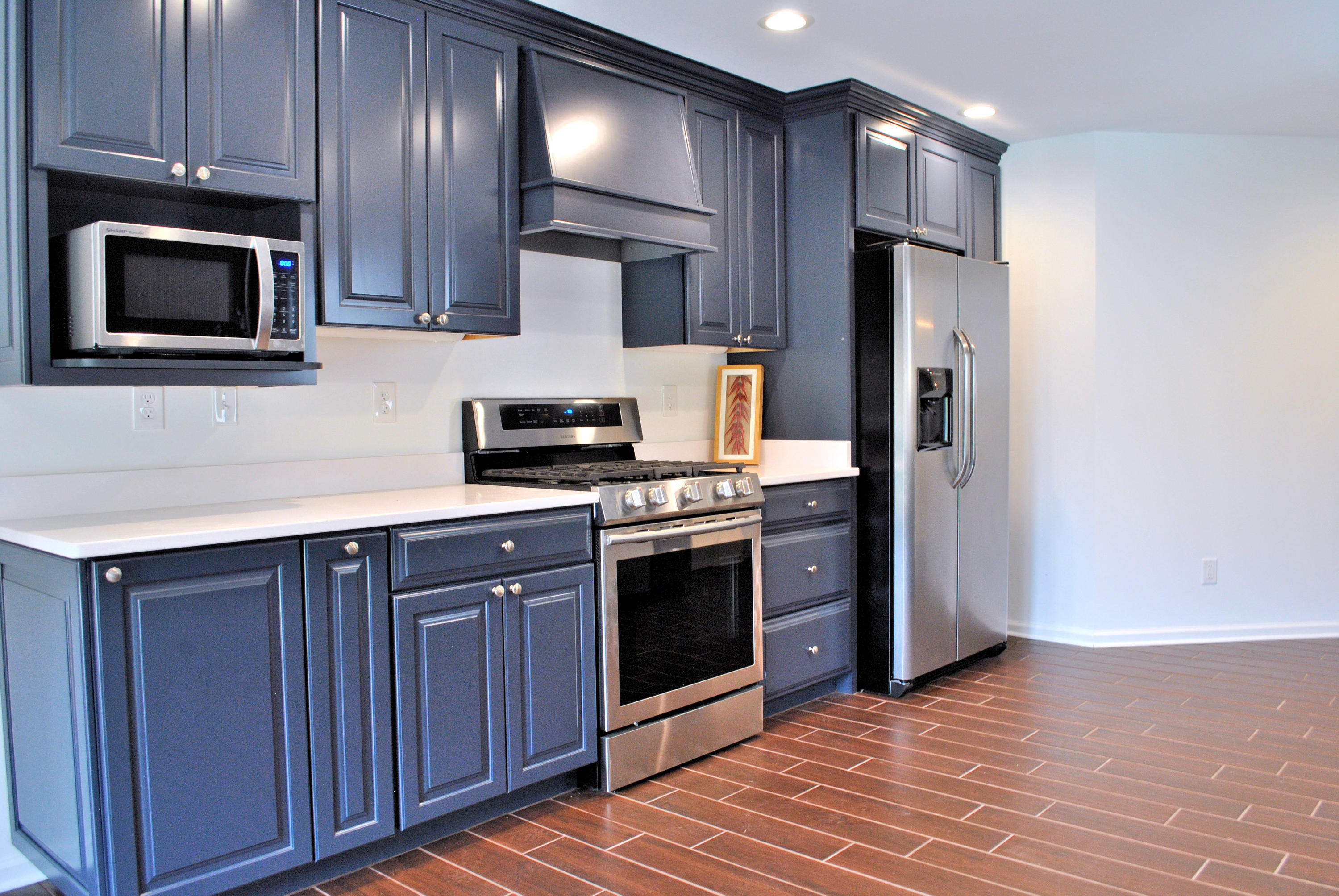 6500 Little Camp Road Riner, VA 24149 - Photo 28 of 121 a kitchen with stainless steel appliances granite countertop a stove a refrigerator and a microwave