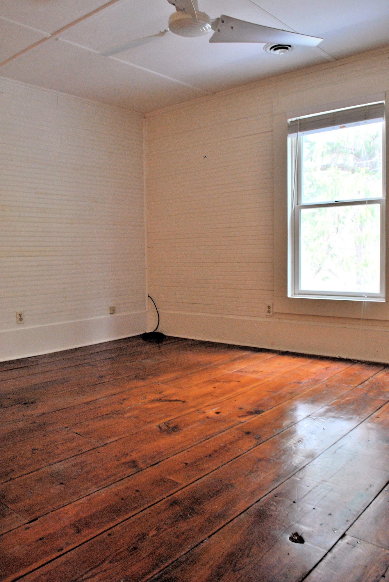 6500 Little Camp Road Riner, VA 24149 - Photo 56 of 121 an empty room with wooden floor and windows