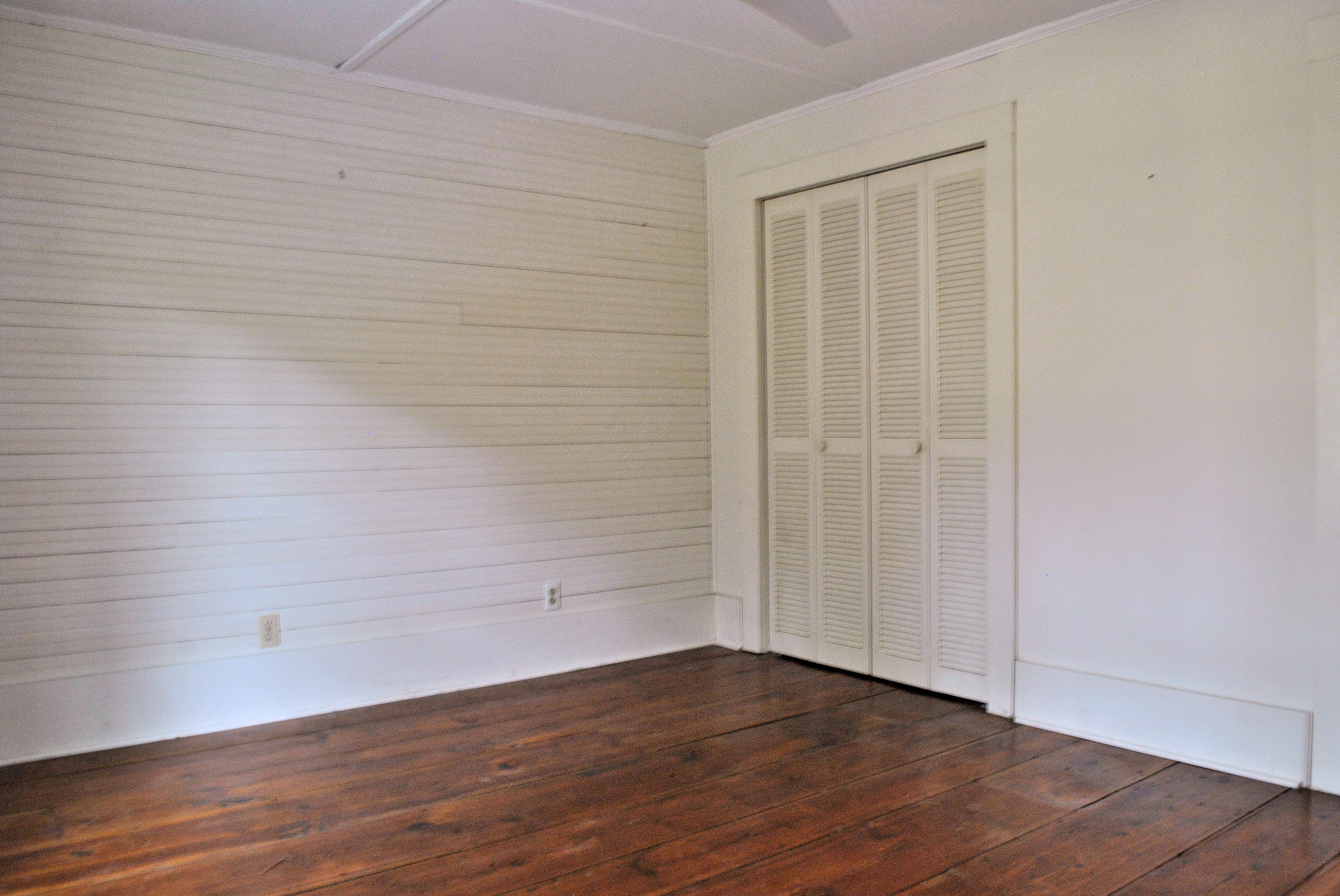 6500 Little Camp Road Riner, VA 24149 - Photo 60 of 121 a view of an empty room with wooden floor and a window