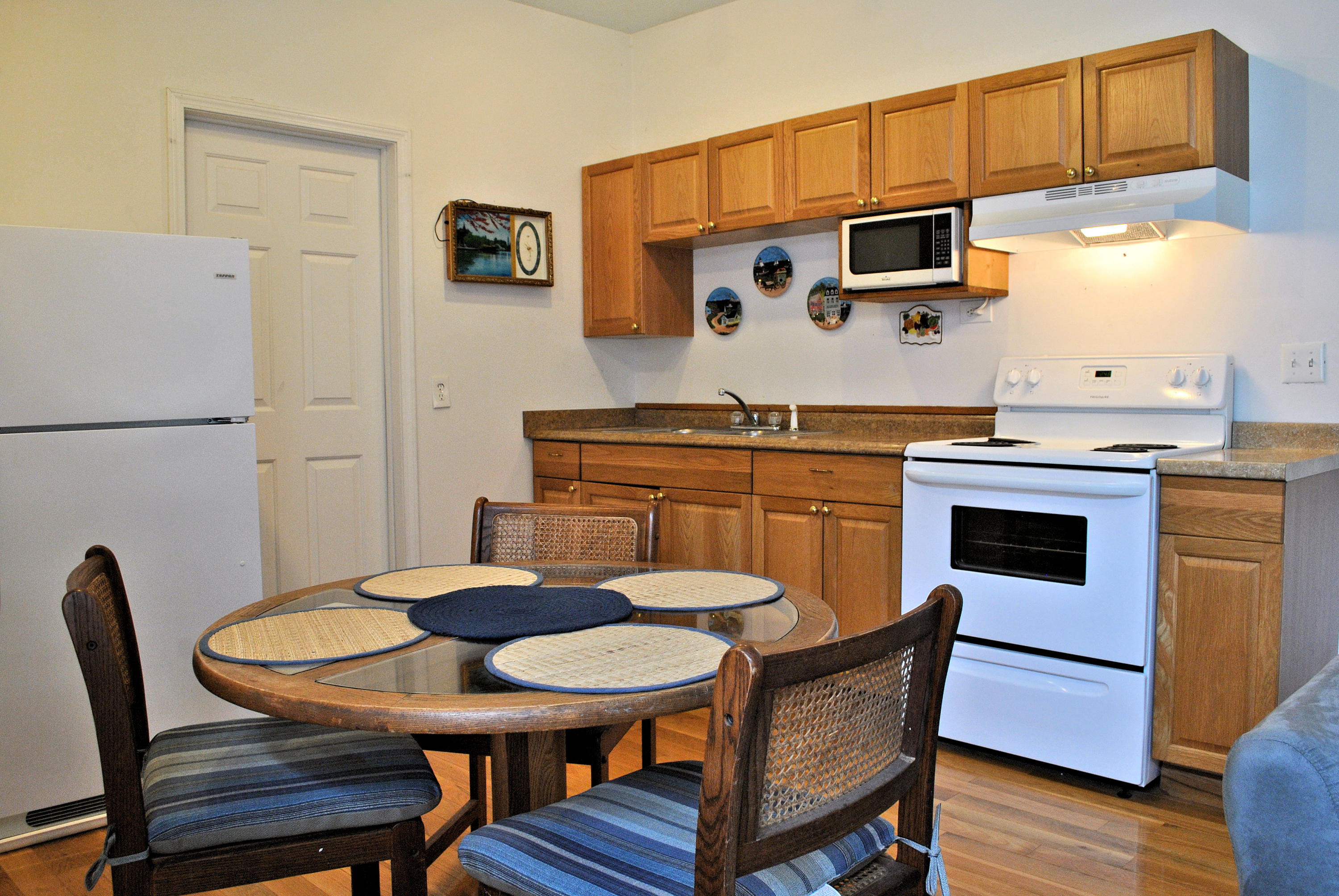 6500 Little Camp Road Riner, VA 24149 - Photo 90 of 121 a kitchen with stainless steel appliances a table chairs and a refrigerator