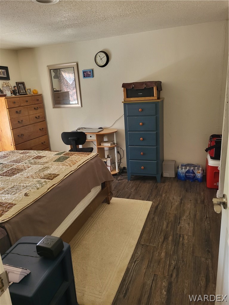 5397 Cordes Road Golden Valley, AZ 86413 - Photo 11 of 50 a bed room with a bed and a television