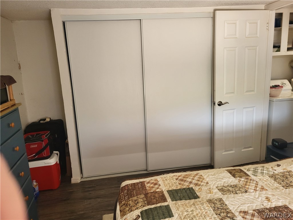 5397 Cordes Road Golden Valley, AZ 86413 - Photo 12 of 50 a bedroom with a bed and wooden floor