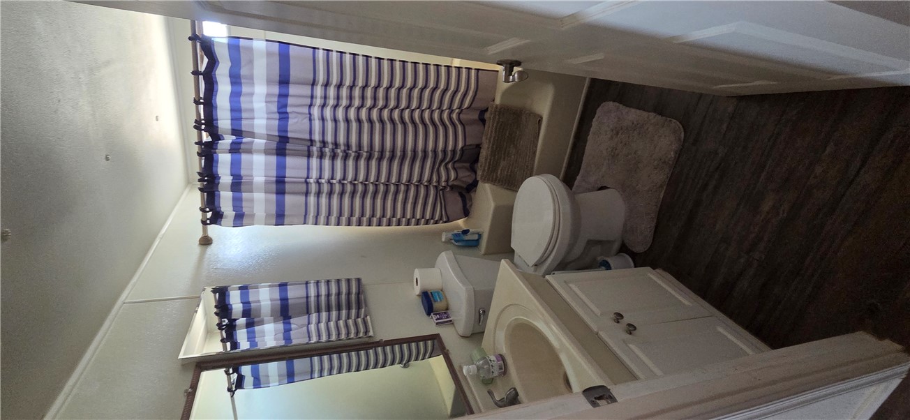 5397 Cordes Road Golden Valley, AZ 86413 - Photo 15 of 50 a bathroom with a sink a toilet and shower