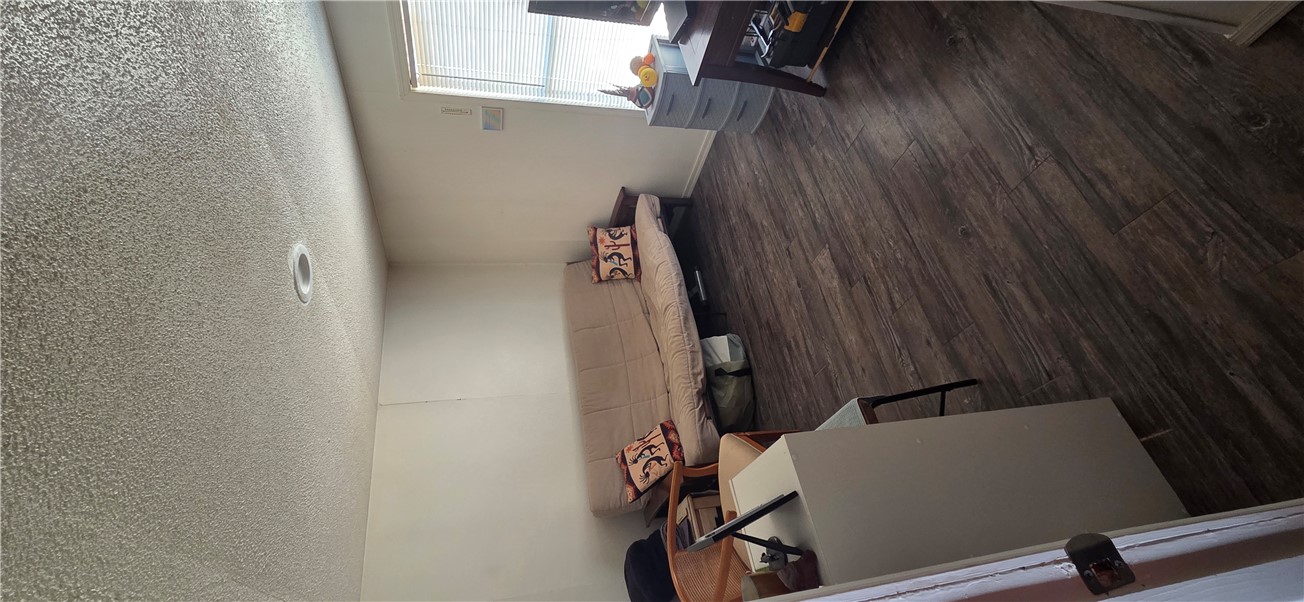 5397 Cordes Road Golden Valley, AZ 86413 - Photo 19 of 50 a room with wooden floor and furniture