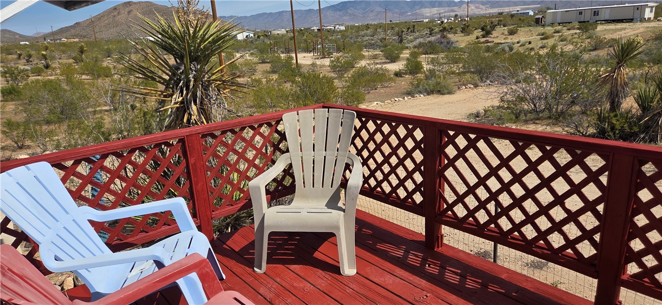 5397 Cordes Road Golden Valley, AZ 86413 - Photo 2 of 50 a view of a balcony with wooden floor